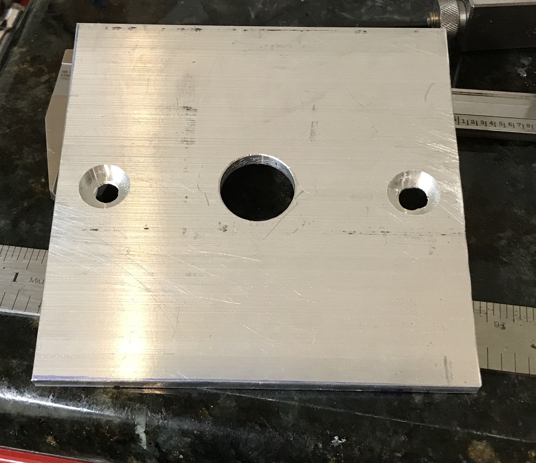 The base after countersinking the two holes for the bolts.